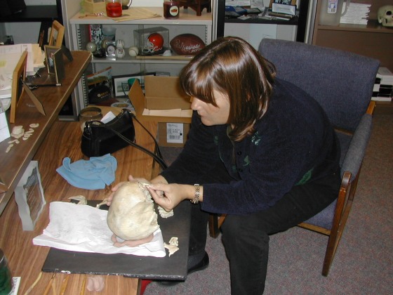 Laura Fulgitini, forensic anthropologist, rebuilds the skull of 'Jane Doe.' She pieced the skull bones together, used clay to fill in the missing pieces and recreated teeth.
